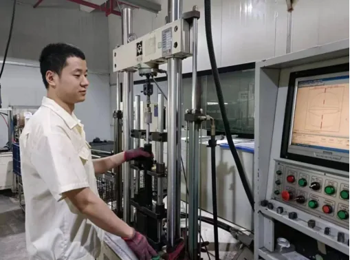 Technician operating testing equipment in a workshop