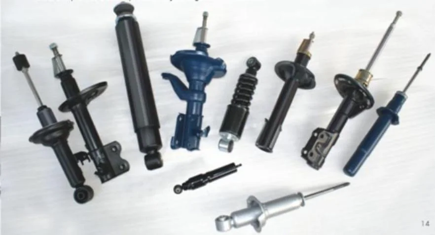 Assortment of shock absorbers and strut products on a white background